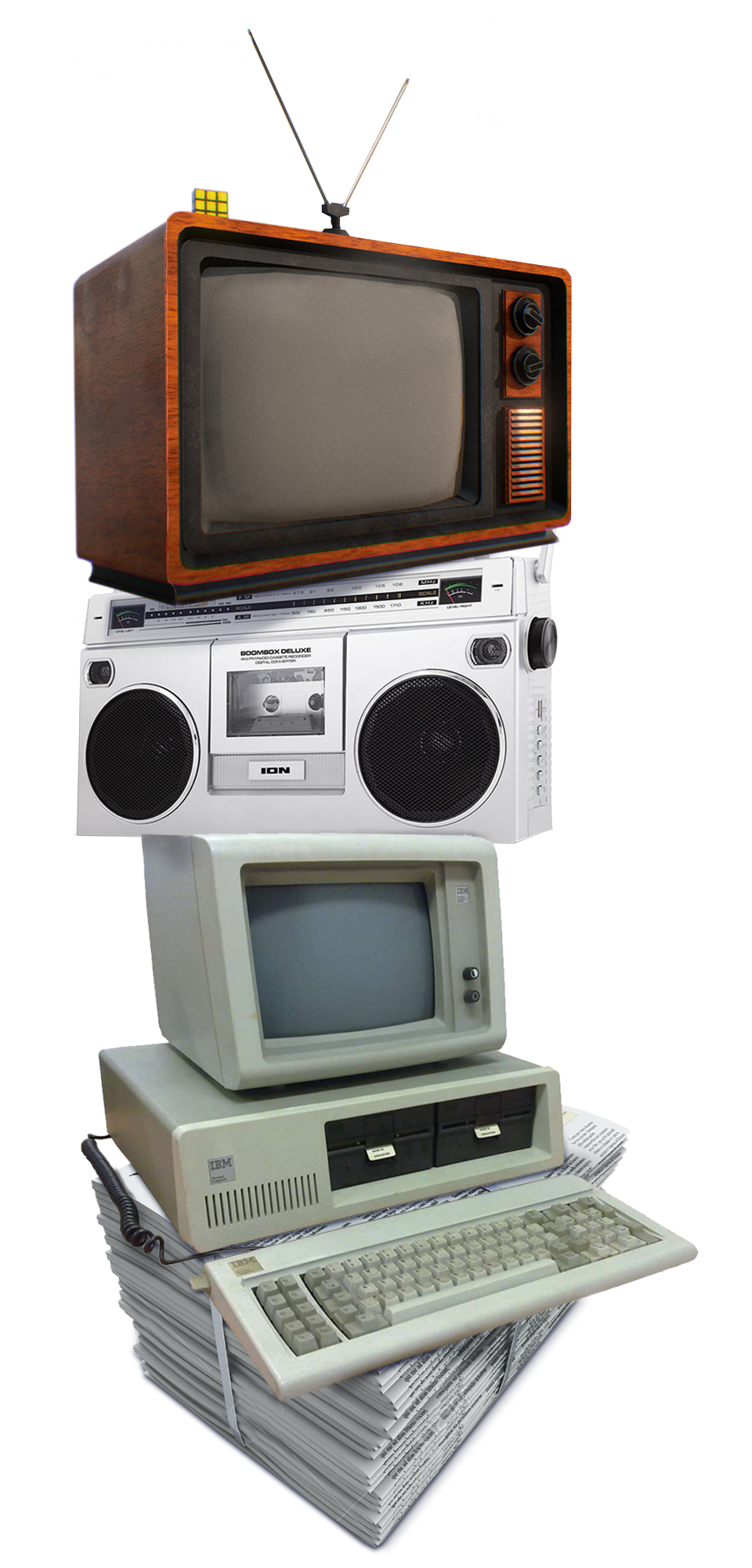 A stack of media. From bottom to top a ream of newspapers, then a computer and monitor, topped with a radio, topped with a television set